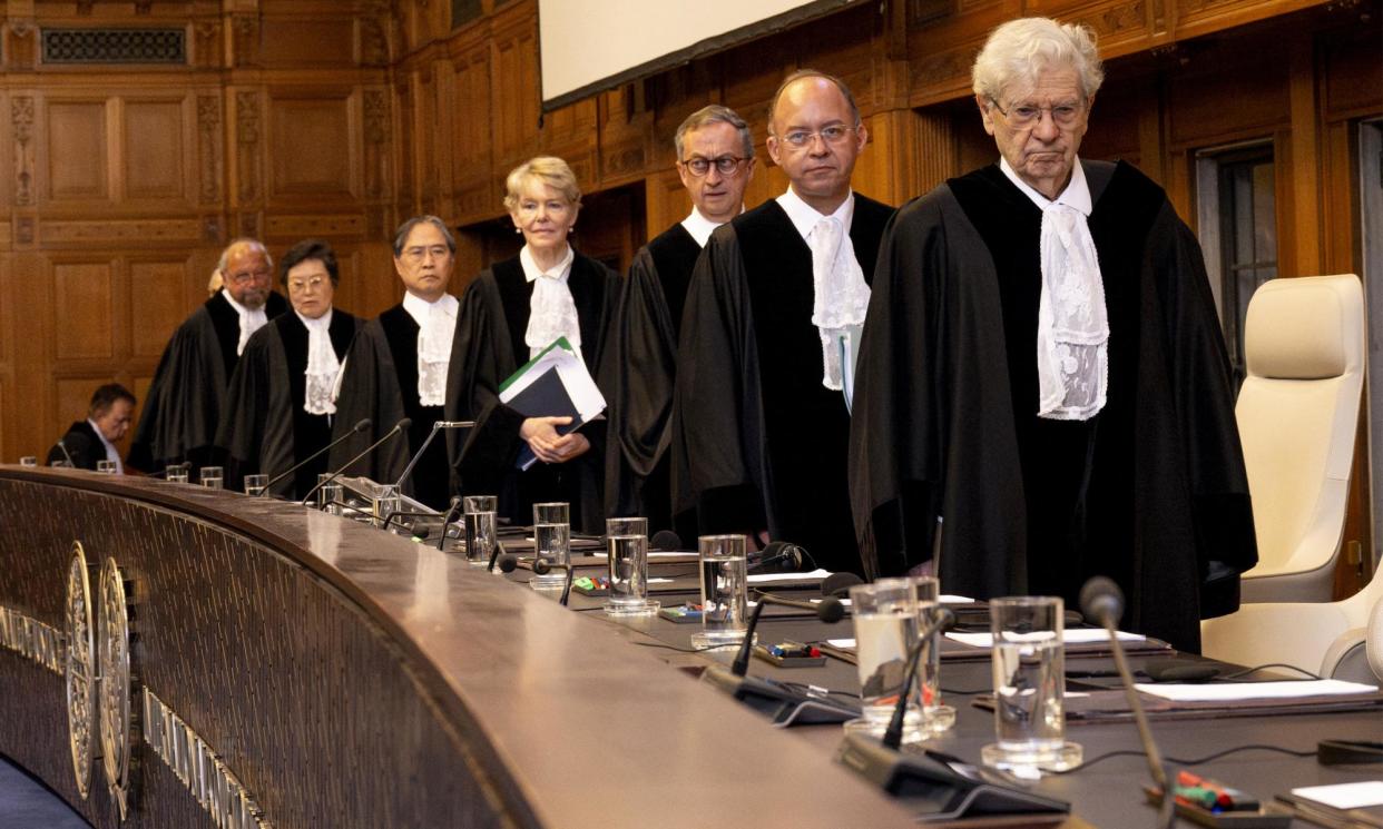 <span>Judges arrive to hear South Africa’s arguments to the international court of justice in The Hague on Thursday.</span><span>Photograph: Nick Gammon/AFP/Getty Images</span>