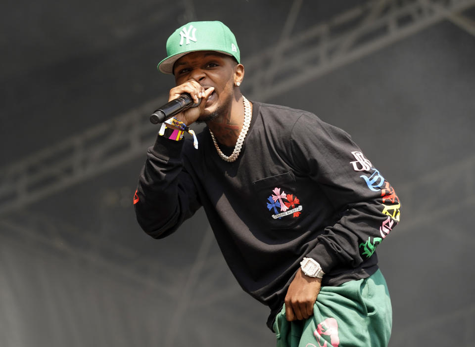 FILE - Toosii performs on day four of the Lollapalooza music festival in Chicago on Aug. 1, 2021. Toosii's "Favorite Song" is one of AP's contenders for song of the summer. (Photo by Rob Grabowski/Invision/AP, File)