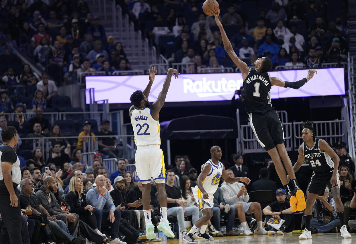 San Antonio Spurs rookie Victor Wembanyama blocks the shot of Golden State Warriors forward Andrew Wiggins during an NBA preseason game on Oct. 20, 2023, at Chase Center in San Francisco. (Photo by Thearon W. Henderson/Getty Images)