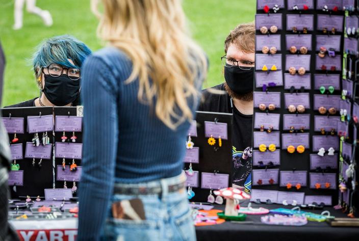 A vendor sells jewelry at the YART sale on Canan Commons during ArtsWalk in October 2021. YART, a Yard Sale for Art, will be back at Canan Commons in downtown Muncie&nbsp;for the Brink of Summer ArtsWalk 5-8 p.m. Thursday, June 2.