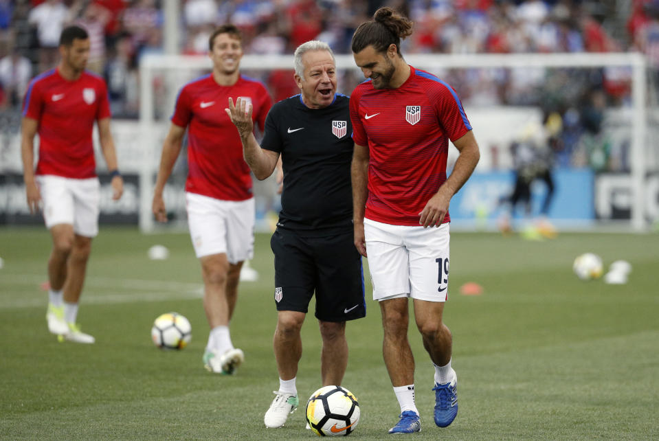 Dave Sarachan talks to Graham Zusi before a July U.S. friendly agains Ghana. (Getty)