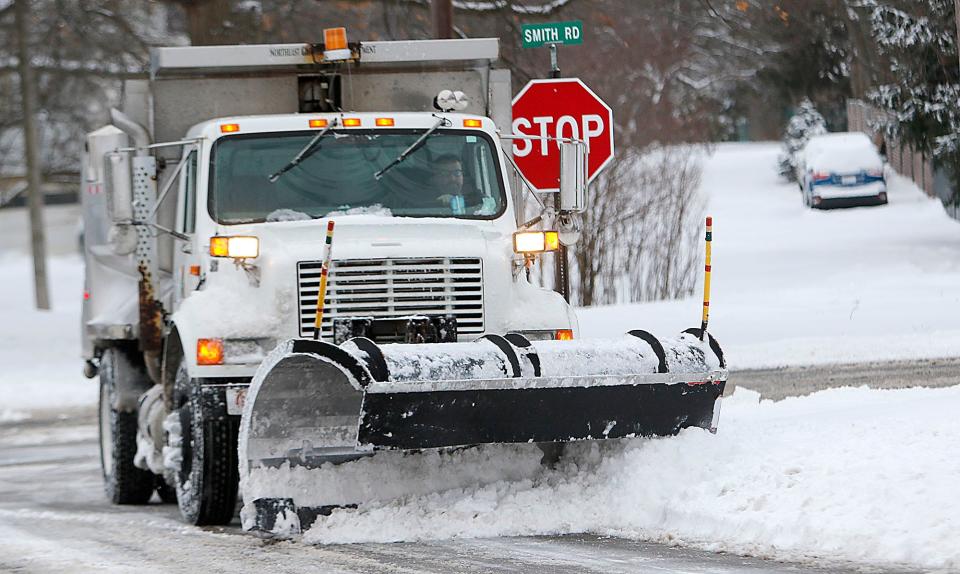 An Ashland snowplow clears Crestview Drive near Smith Road on Monday.