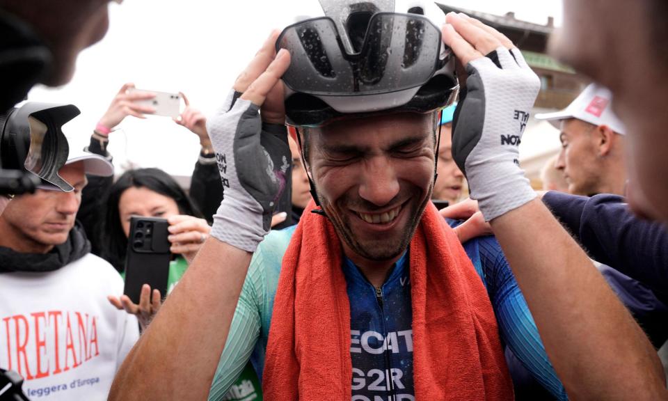 <span>Andrea Vendrame shows his emotion after winning the stage with a punishing 30km solo effort.</span><span>Photograph: Marco Alpozzi/LaPresse/Shutterstock</span>