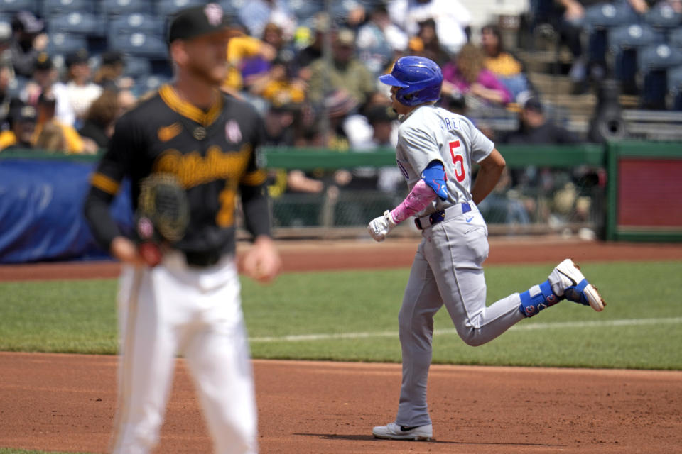 Chicago Cubs' Christopher Morel (5) rounds the bases after hitting a two-run home run off Pittsburgh Pirates starting pitcher Bailey Falter, left, during the first inning of a baseball game in Pittsburgh, Sunday, May 12, 2024. (AP Photo/Gene J. Puskar)
