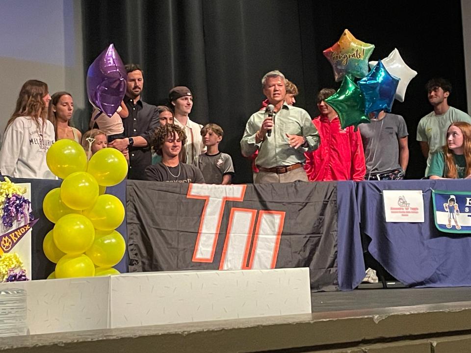 Soccer player Tiernan Mead (seated), joined by family, was one of several Cocoa Beach seniors signing with college sports programs on May 8, 2024.