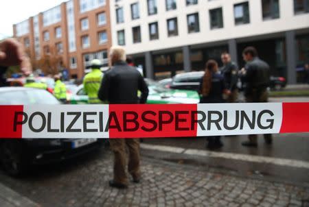 German police officers guard the site where earlier a man injured several people in a knife attack in Munich, Germany, October 21, 2017.