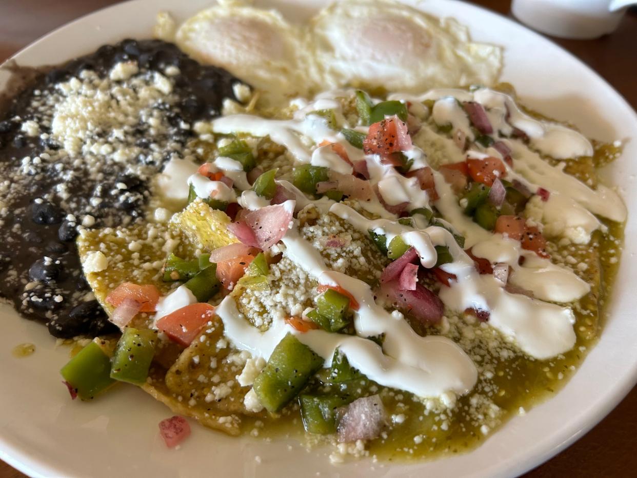 The chilaquiles at La Crema in Cudahy feature house-made salsa verde and pico de gallo, served with sour cream, queso fresco, two eggs and black beans.