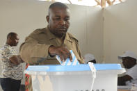 A man casts his vote Wednesday, Oct. 28, 2020, in Dodoma, Tanzania, for a presidential election that the opposition warns is already deeply compromised by manipulation and deadly violence. (AP Photo)