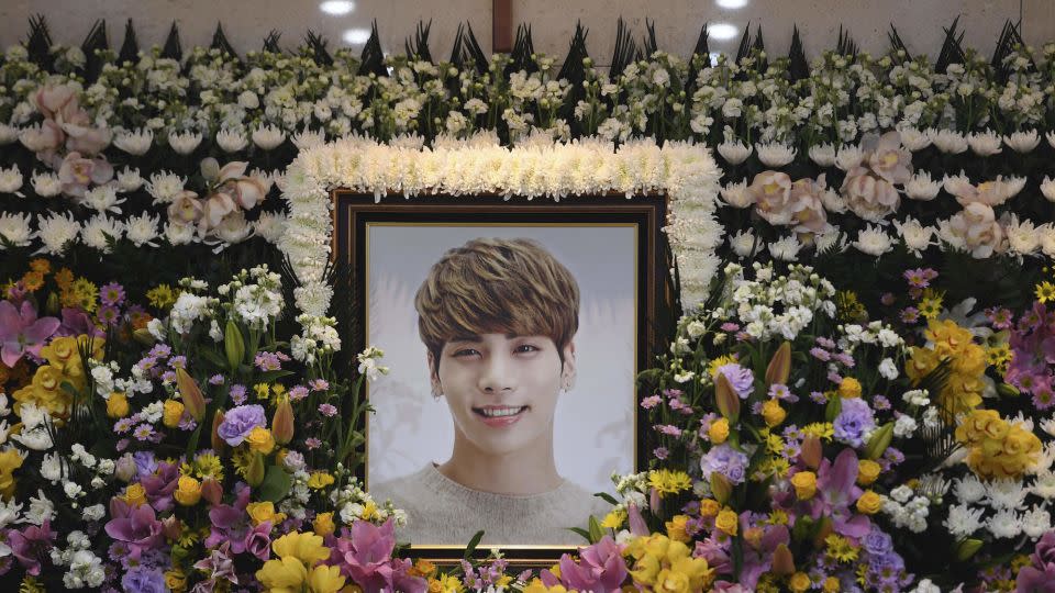 A portrait of Kim Jong-hyun, better known by the stage name Jonghyun, seen at makeshift shrine in Seoul, December 19, 2017 - Yonhap/AP