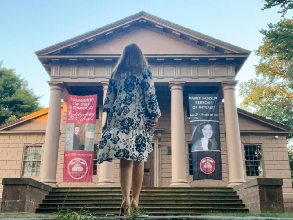 andrea walking toward redwood library in newport rhode island