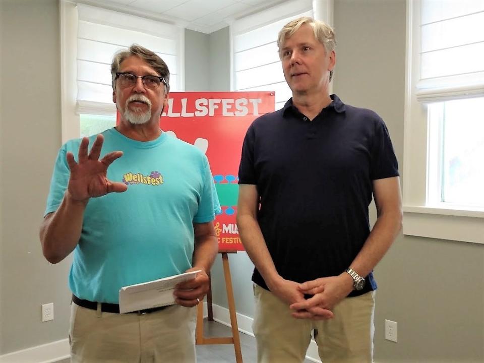 From left, Wells Church Senior Pastor Chris Cumbest discusses WellsFest with Robert Langford, Executive Director of Operation Shoestring, the non-profit chosen as the festival’s 2023 beneficiary.