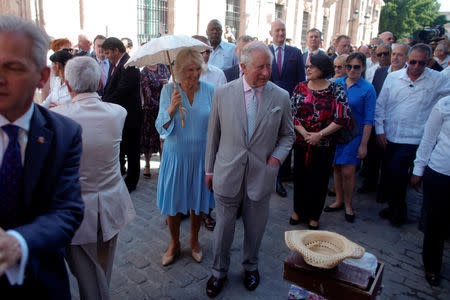 Britain's Prince Charles and Camilla, Duchess of Cornwall walk during a visit in Old Havana, Cuba March 25, 2019. REUTERS/Alexandre Meneghini