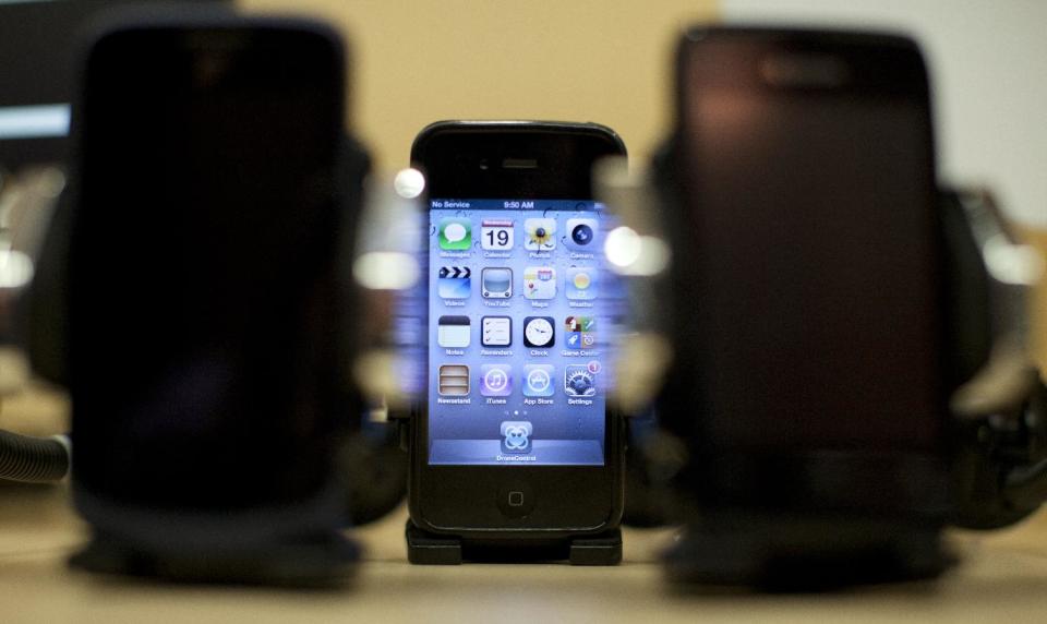 Cell phones are displayed during a Federal Trade Commission (FTC) mobile tracking demonstration, Wednesday, Feb. 19, 2014, in Washington. You might want to keep your cellphone home _ or at least turn it off _ when you go shopping. Stores are using technology to track consumers’ movements, but they say the information is anonymous. The Federal Trade Commission takes a look at the information these companies are collecting, how long they are keeping it and what it’s being used for. (AP Photo/Carolyn Kaster)