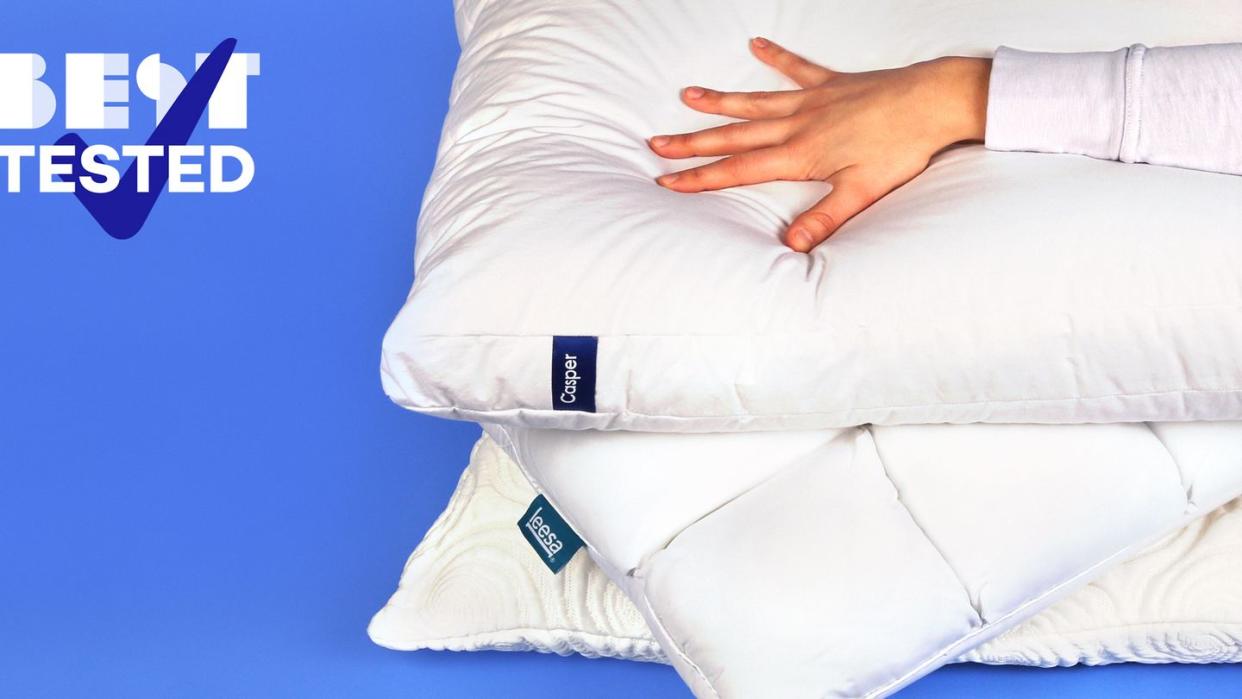 best tested hand pressing down on bed pillows