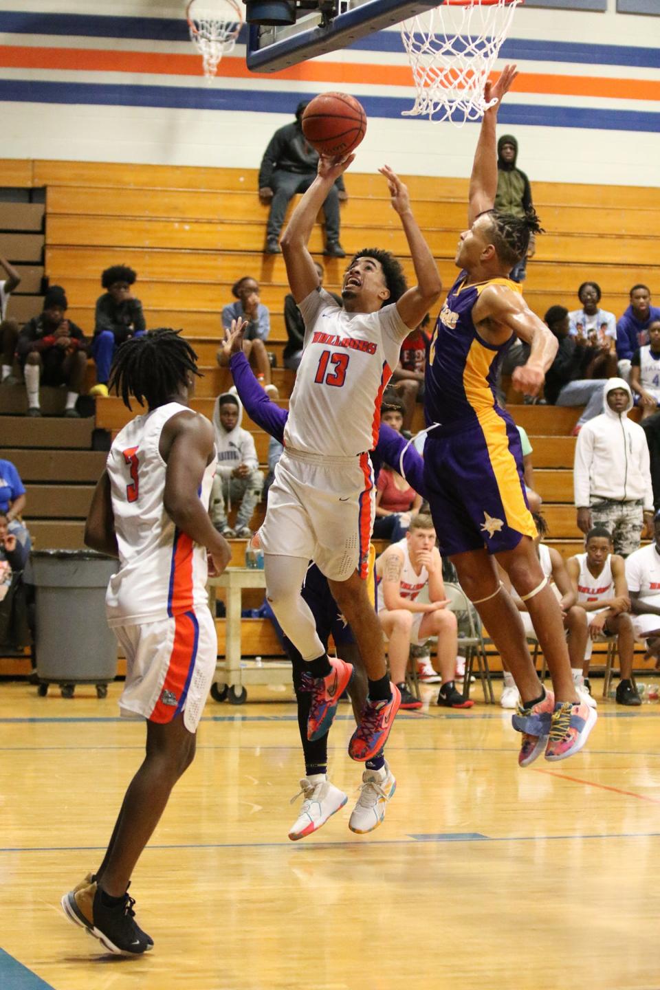 Taylor County senior guard Jayden Florence (13) goes up for a layup in a game against Port St. Joe on Dec. 11, 2021 at Taylor County High School.