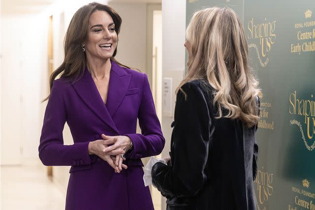 <p>Richard Pohle - WPA Pool/Getty Images</p> Kate Middleton chats with Fearne Cotton as she arrives for the Shaping Us National Symposium in London on November 15.