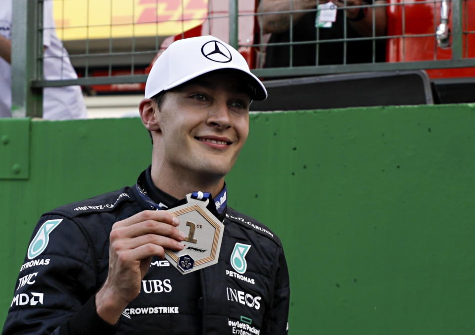 Mercedes driver George Russell, of Britain, celebrates winning the Sprint Race qualifying session at the Interlagos racetrack, in Sao Paulo, Brazil, Saturday, Nov. 12, 2022. The Brazilian Formula One Grand Prix will take place on Sunday. (AP Photo/Marcelo Chello)