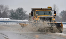 <p>A Penn DOT plow truck clears snow and slush from West 12th Street just east of the Erie International Airport in Millcreek Township, Erie County, Pa., March 7, 2018, after a morning snowfall. (Photo: Christopher Millette/Erie Times-News via AP) </p>