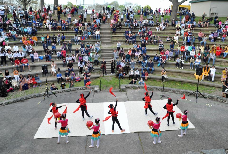 A Chinese dance is performed by the Boston Chinese Dance school of Quincy in the Ruth Gordan Amphitheater during the Quincy Multicultural Festival at Pageant Field on Thursday, May 5, 2022.