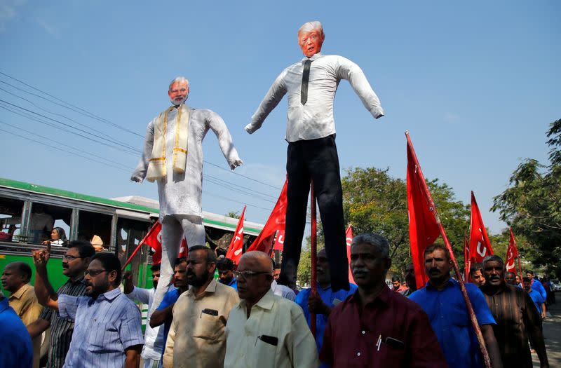 Supporters of Centre of India Trade Union (CITU) carry effigies depicting U.S President Donald Trump and India's Prime Minister Narendra Modi during a protest against Trump's visit to India, in Kochi