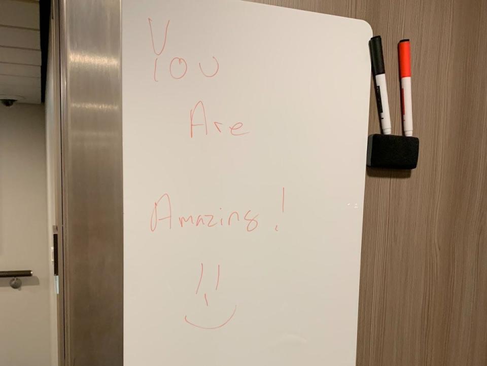 white board on a cruise ship with you are amazing on it