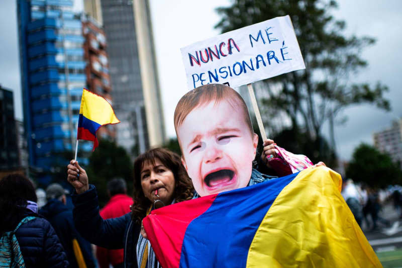 Demonstrators take part in a protest against the reform bills on health, retirement, employment and prison sectors, in Bogota. Sebastian Barros/LongVisual via ZUMA Press Wire/dpa