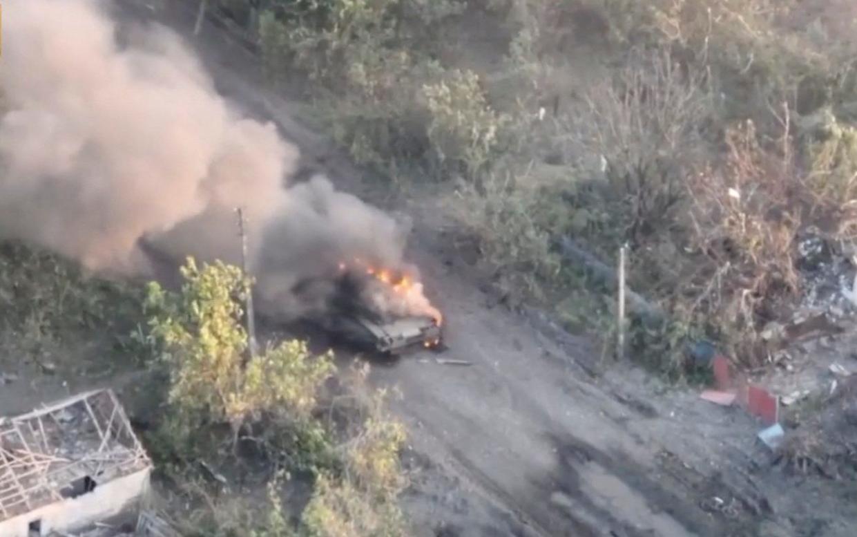 A tank burns as Ukrainian armed forces liberate the town of Staromaiorske