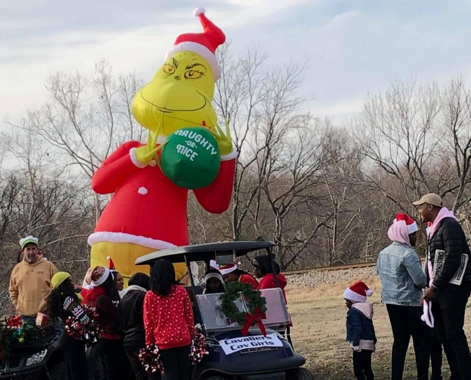 Participants prepare for the parade during "An Old Towne Christmas" in Petersburg in 2019.