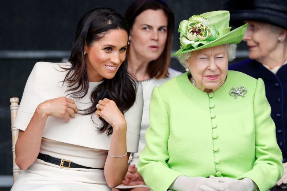 Meghan Markle and Queen Elizabeth II — accompanied by Samantha Cohen (center), then private secretary to Prince Harry and Meghan, and former assistant private secretary to the Queen — attend a ceremony to open the new Mersey Gateway Bridge on June 14, 2018, in Widnes, England. Getty Images