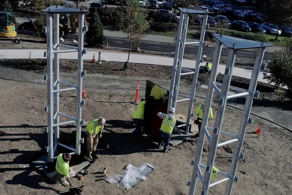 Installation of the panels of the Stefan Knapp mural in the courtyard of the of new Valley Hospital in Paramus, NJ on Wednesday Oct. 11, 2023.