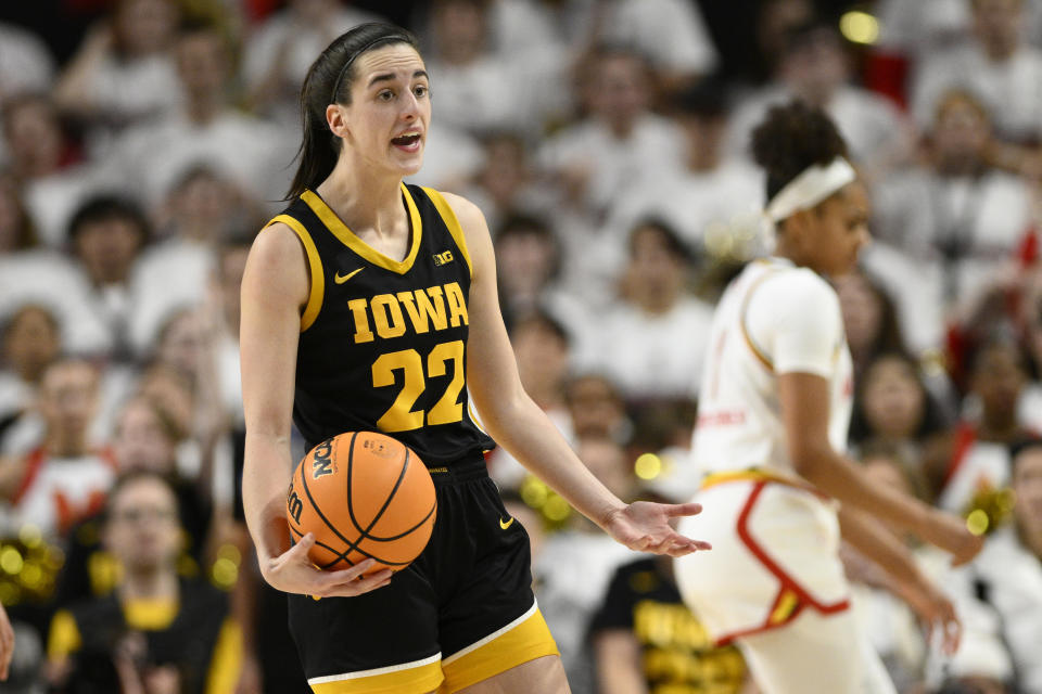 Iowa guard Caitlin Clark (22) reacts after a call during the second half of an NCAA college basketball game against Maryland, Saturday, Feb. 3, 2024, in College Park, Md. (AP Photo/Nick Wass)