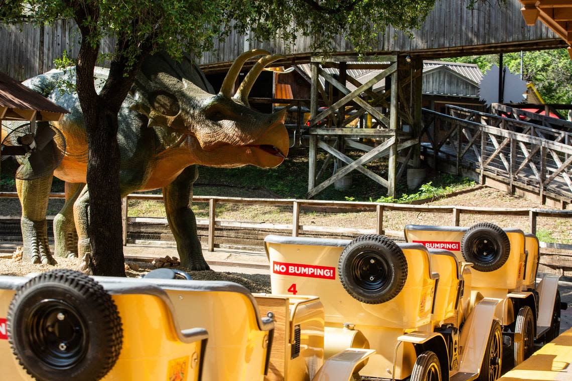 An animatronic dinosaur at Six Flags Over Texas’ ride Dino Off Road Adventure on Friday, June 21, 2024, in Arlington.. The ride travels on a fixed track with animatronic dinosaurs around every corner.