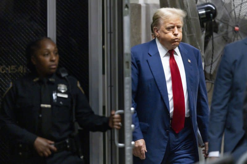 Former President Donald Trump returns to the courtroom after a recess in his criminal trial at Manhattan Criminal Court in New York on Tuesday. Pool Photo by Justin Lane/UPI