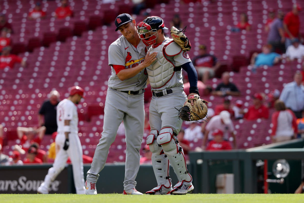 CINCINNATI, OHIO - SEPTEMBER 01: Giovanny Gallegos #65 and Andrew Knizner #7 of the St. Louis Cardinals celebrate after beating the Cincinnati Reds 5-4 during game one of a doubleheader at Great American Ball Park on September 01, 2021 in Cincinnati, Ohio. (Photo by Dylan Buell/Getty Images)