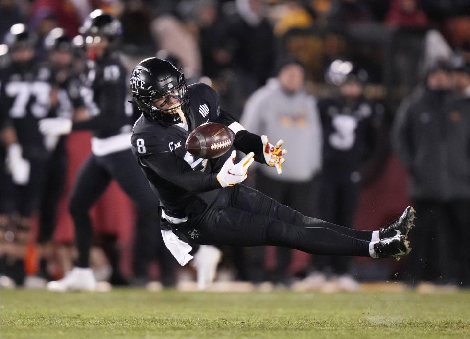 Iowa State receiver Xavier Hutchinson dives for a catch against Texas Tech on Nov. 19. The former Bartram Trail receiver, a semifinalist for the Biletnikoff Award, led NCAA Division I football in receptions this year.