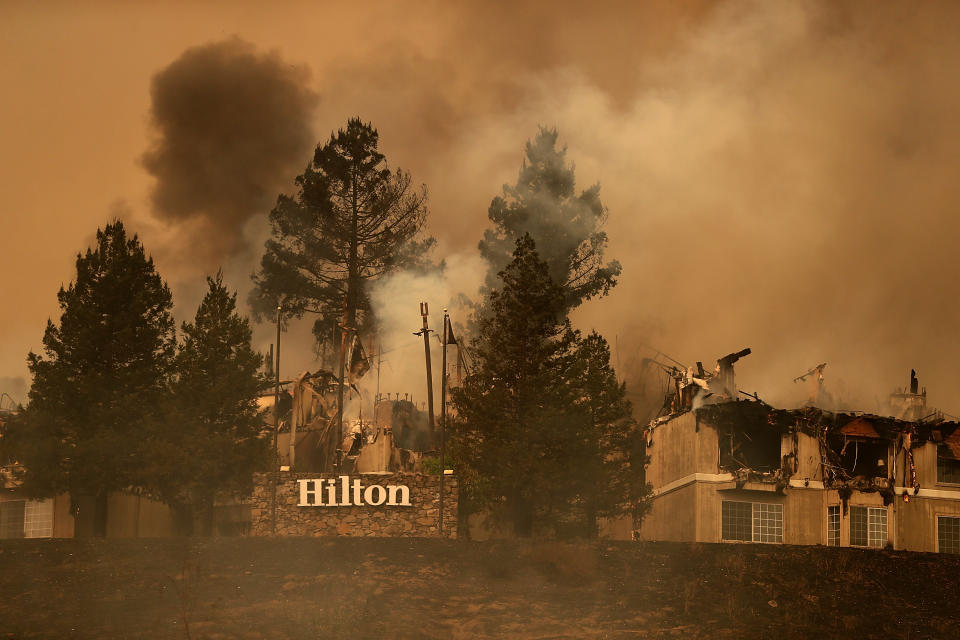 <p>Smoke continues to rise from the Hilton Sonoma Wine Country on Oct. 9, 2017 in Santa Rosa, Calif. (Photo: Justin Sullivan/Getty Images) </p>