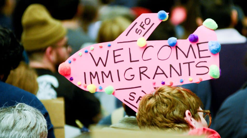 Demonstrators hold welcome signs for immigrants during second day of anti-Donald Trump immigration ban protests inside Terminal 4 at San Francisco International Airport in San Francisco