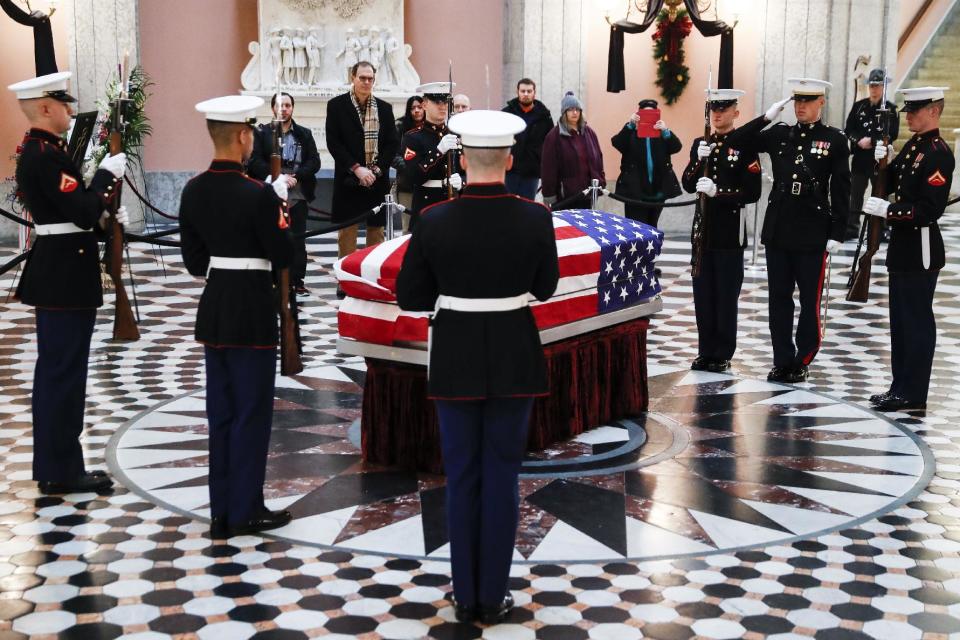 Marines stand guard at the casket of John Glenn, Friday, Dec. 16, 2016, in Columbus, Ohio. Glenn's home state and the nation began saying goodbye to the famed astronaut who died last week at the age of 95. (AP Photo/John Minchillo)