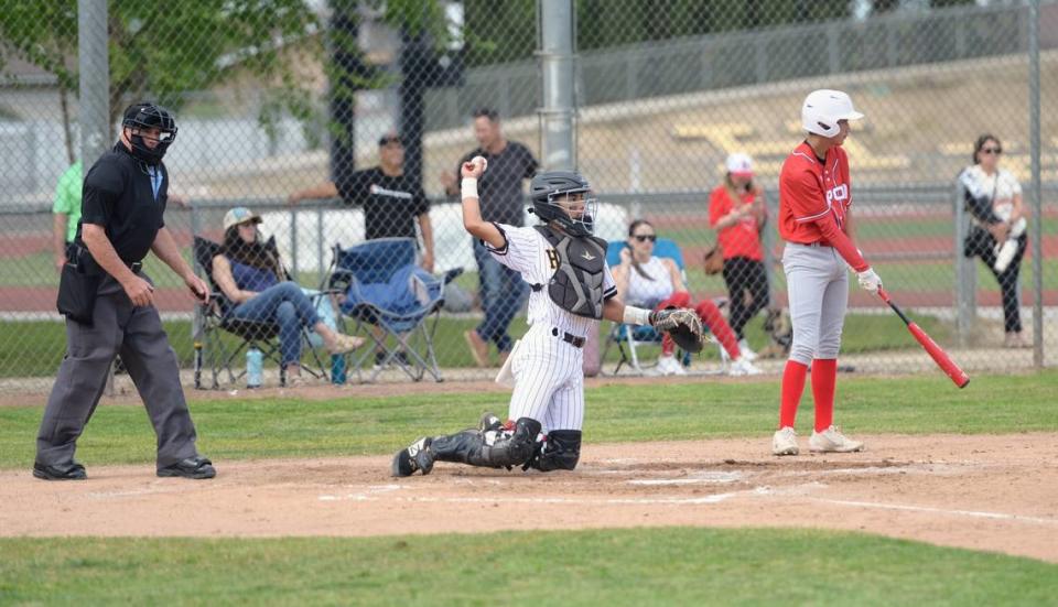 Hughson catcher JC Lupercio throws the ball back to the pitcher during a Trans Valley League game against Ripon at Ripon High School in Ripon, Calif. on April 18, 2024.