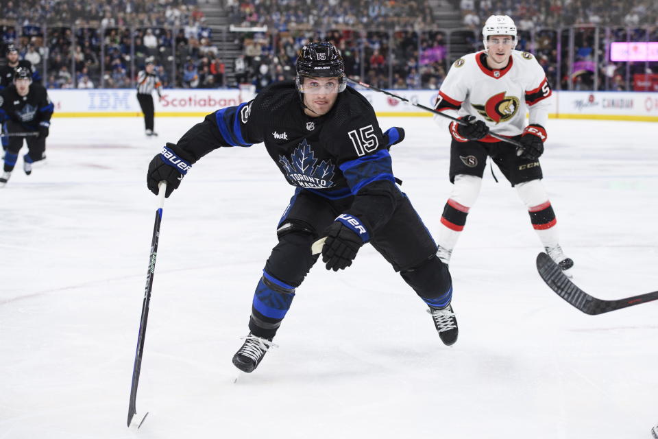 Toronto Maple Leafs forward Alexander Kerfoot (15) skates toward the puck during the second period of the team's NHL hockey game against the Ottawa Senators on Friday, Jan. 27, 2023, in Toronto. (Christopher Katsarov/The Canadian Press via AP)