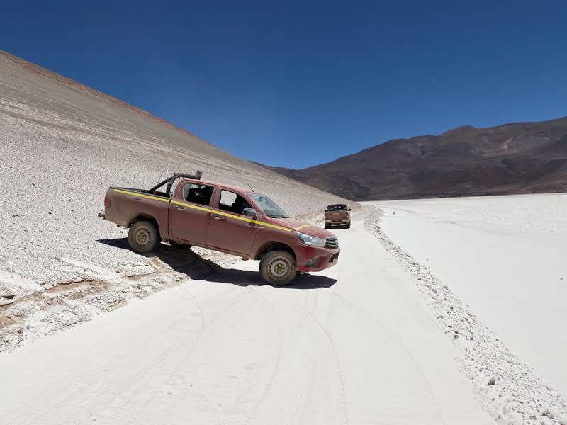 A truck moves on Aguilar Salt Flat in the Atacama Desert