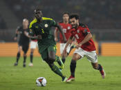 FILE - Senegal's Kalidou Koulibaly, left, challenges Egypt's Mohamed Salah during the African Cup of Nations 2022 final soccer match between Senegal and Egypt at the Ahmadou Ahidjo stadium in Yaounde, Cameroon, Sunday, Feb. 6, 2022. (AP Photo/Themba Hadebe, File)