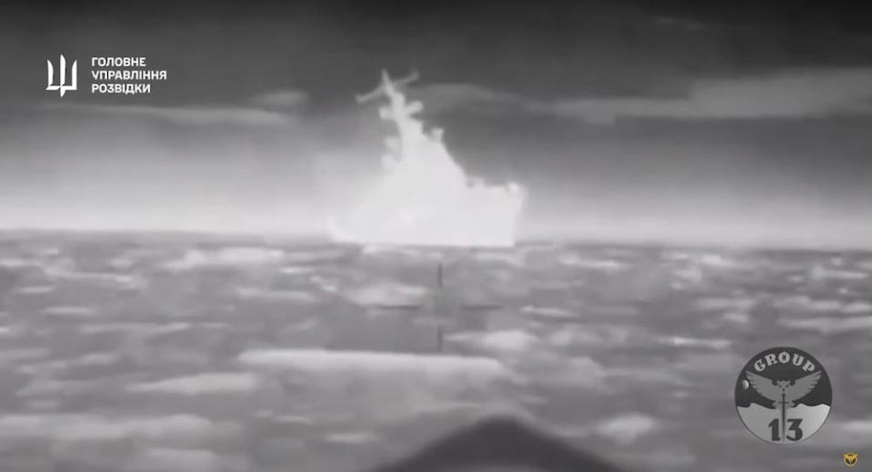 A still from a video shared by Defense Intelligence of Ukraine on Thursday February 1 2024. the black and white reversed image shows a ship silhouetted on the water, which Ukraine says is a drone's eye view ahead of the ship's destructon.