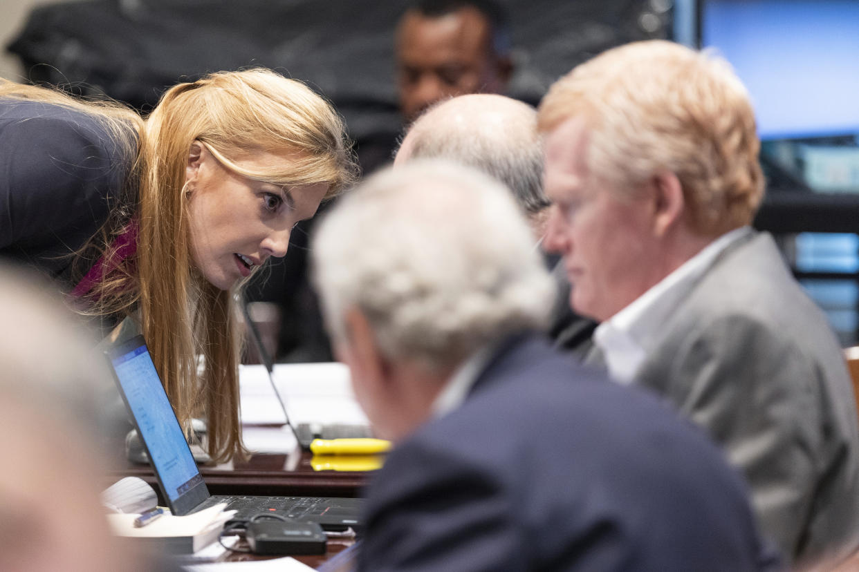 Defense attorney Margaret Fox speaks with her colleagues during Alex Murdaugh's trial for murder at the Colleton County Courthouse in Walterboro, S.C., on Wednesday, Feb. 22, 2023. The 54-year-old attorney is standing trial on two counts of murder in the shootings of his wife and son at their Colleton County, S.C., home and hunting lodge on June 7, 2021. (Joshua Boucher/The State via AP, Pool)