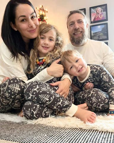 <p>Brie Garcia/ Instagram</p> Brie Garcia and Bryan Danielson with their kids Birdie and Buddy.