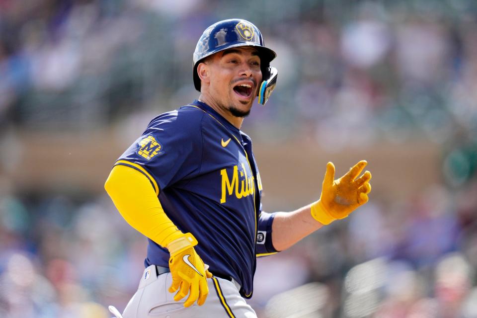 Brewers shortstop Willy Adames shouts into the Diamondbacks dugout as he rounds the bases after hitting a two-run home run during the first inning Sunday.