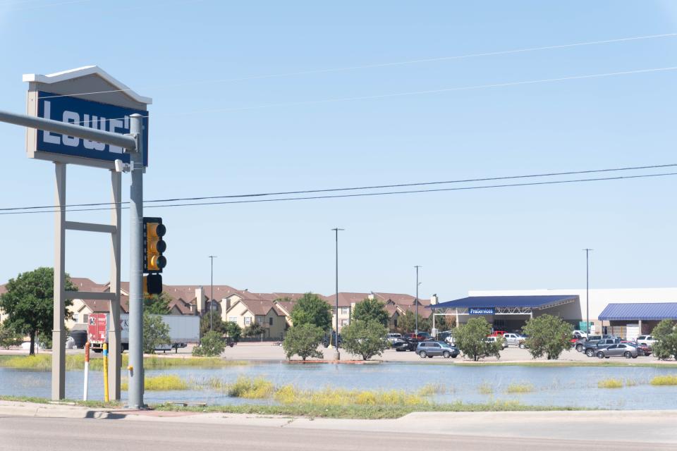 A playa lake formed on Coulter Street Saturday near Lowes in Amarillo, sitting full of water from recent rains.