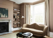 <p> This living room is painted in Mylands Egerton Place No.297, it&apos;s a mushroom shade that includes umber and a hint of red. It&apos;s very earthy which gives it a warm cozy feel.&#xA0; </p> <p> For a more modern look paint the architectural details in the same shade as the walls plus the bookcase, then use white for the ceiling, skirtings and accessories. We love the pop of the Dino floor lamp by Gong that looks striking against the wall color, use beige drapes for contrast and pick a matching rug.&#xA0; </p>
