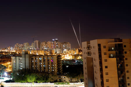 Streaks of light are pictured as rockets are launched from the Gaza Strip towards Israel, as seen from the Israeli city of Ashkelon May 4, 2019 REUTERS/ Amir Cohen