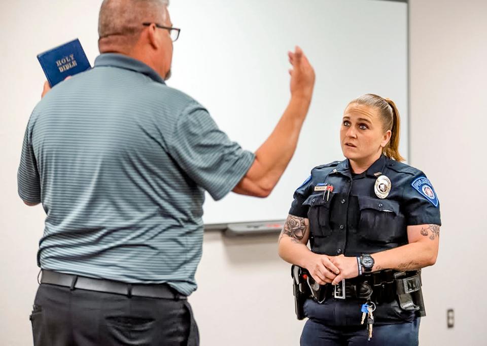 During a role-playing training exercise, Blanchard police officer Tawny McClintock assesses a man who is preaching loudly outside of a business, played by Norman Police Lt. Cary Bryant. These scenarios are the culmination of a 40-hour crisis intervention training that teaches law enforcement officers how to recognize and respond to mental health crises.